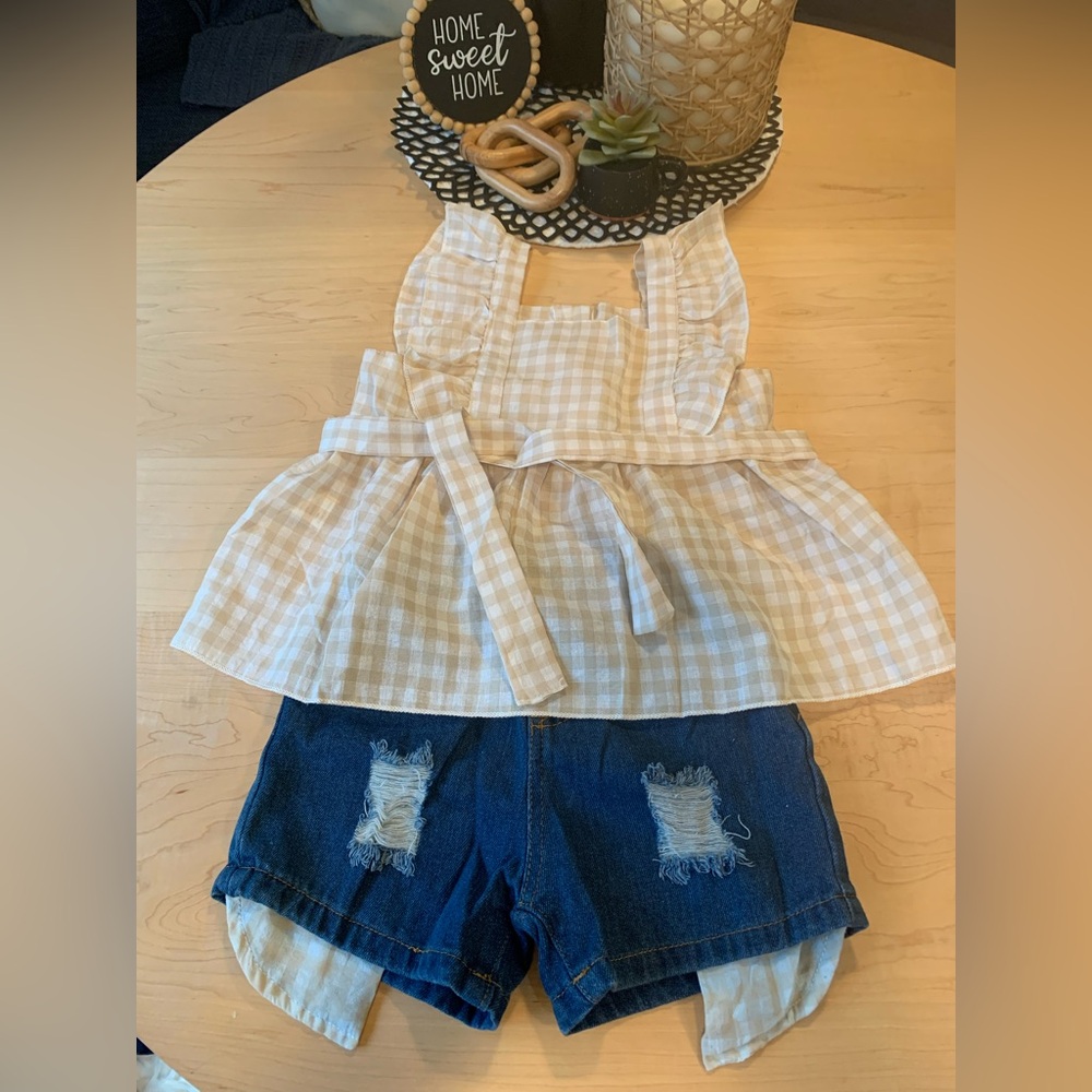 Girls top with jean shorts. Says size 4-5Y